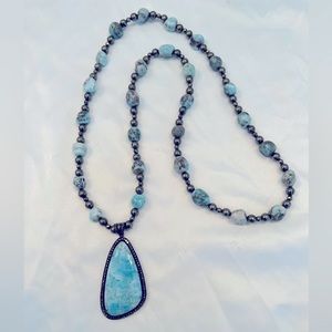 Gorgeous necklace Larimar and Pyrite stones with a Pave Diamond pendant.